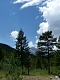 A jak je v horách zvykem, žene se na nás odpolední bouře. | As is usual in the mountains, an afternoon thunderstorm is brewing above us.