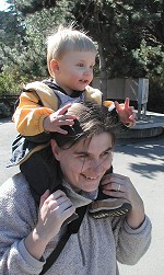 At a ZOO: Tom on his mother's back