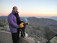 Tommy standing on a small wall at Keys Point, Joshua Tree