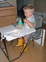 Tom dines while wearing his Wellingtons