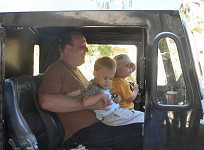 Tom, Sid and K.C. on a train engine