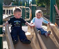 Eli and Tom on a slide.