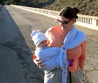 Lisa has again started to get carried in a sling.