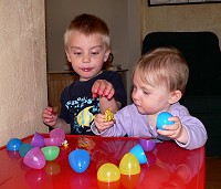 Siblings unpacking the eggs