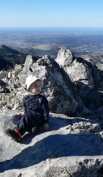 Mountain climber Tom, on top