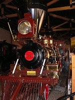 A beatifully restored steam engine in a museum