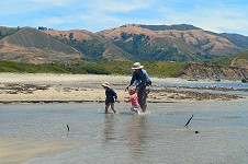 Kids with granny run in the Big Sur river