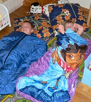 Kids play wilderness camping - in their room