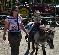 Lisa atop a pony