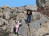 Tom a Lisa climibing rocks at Point Lobos