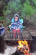 Tomášek gazing thoughtfully into flames