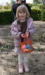 Lisa strikes a pose even while collecting eggs.