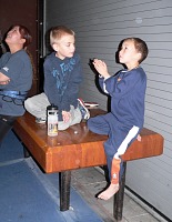 Boys playing with laser pointer.