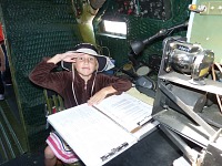 Lisa in the C-47 Skytrain navigator seat.