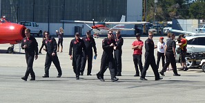 Patriots perform a dry run of their formations on the Salinas airport tarmac.