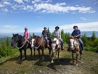 Whole family on a horse back ride at Artemis Acres in Montana.