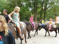 Girls on ponies.