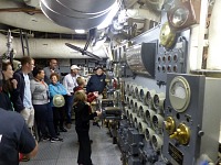 Kids were allowed to turn valve controls during our lecture in the engine room.