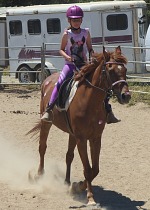 Lisa on a heart-enhanced horse.