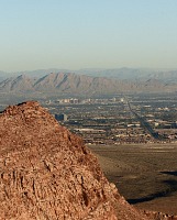 From the top of Red Rock, one can observe Charleston Boulevard
			cutting through many miles of Las Vegas, Nevada.