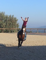 Lisa on a cantering horse.