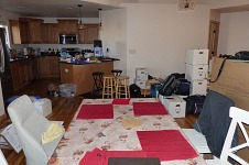 Cramped in our kitchen, with boxes, old furniture and new furniture.