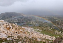 When you find yourself in a hailstorm on a mountain, a rainbow forms over the valley.