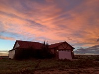 The sun has set behind our little house.