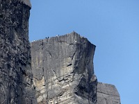 Tourists milling on the edge of the Pulpit Rock. Tourists milling on the edge of the Pulpit Rock.