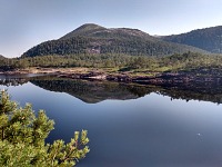 Gangstø: Klubben (1,152 ft = 352 m) reflects in Austrevatnet Lake.
