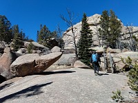 Attempting to hide from the wind in Box Canyon.